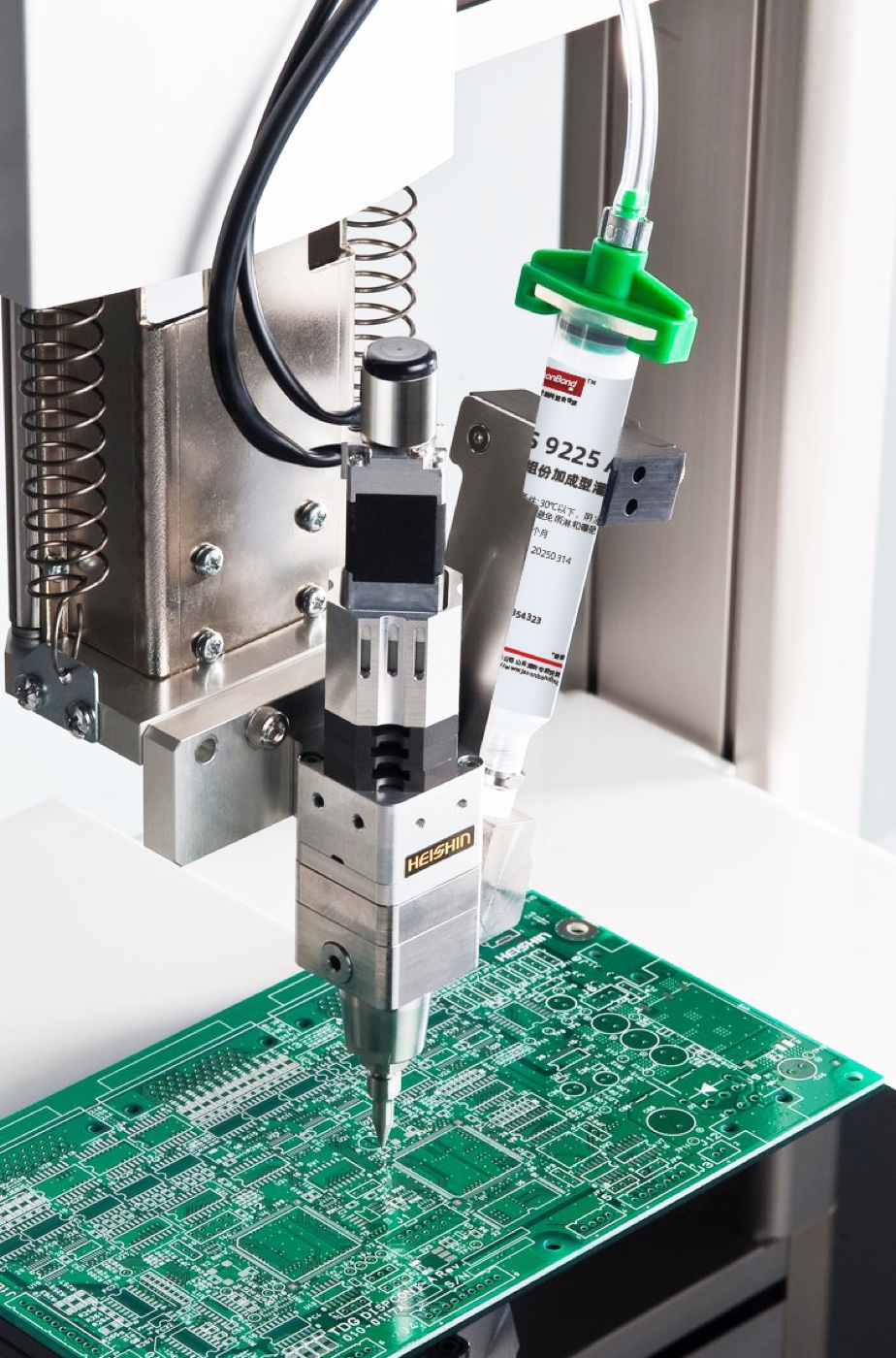 Precision adhesive dispensing on a circuit board